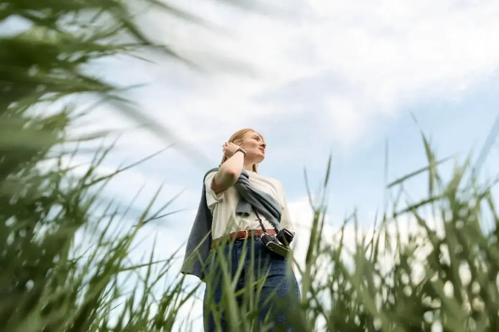 young woman, blond hair, looking into the distance